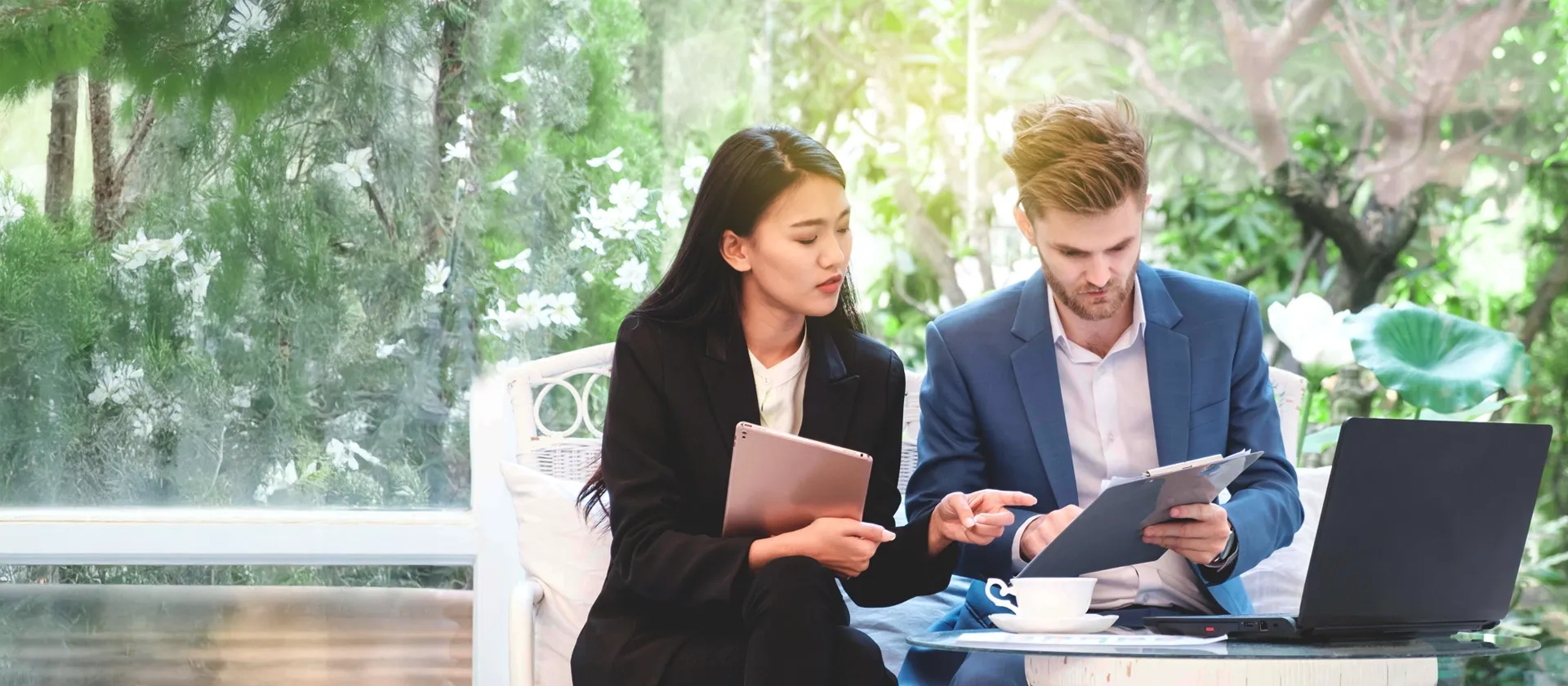 two people on a meeting going throught sustainability strategy and reports