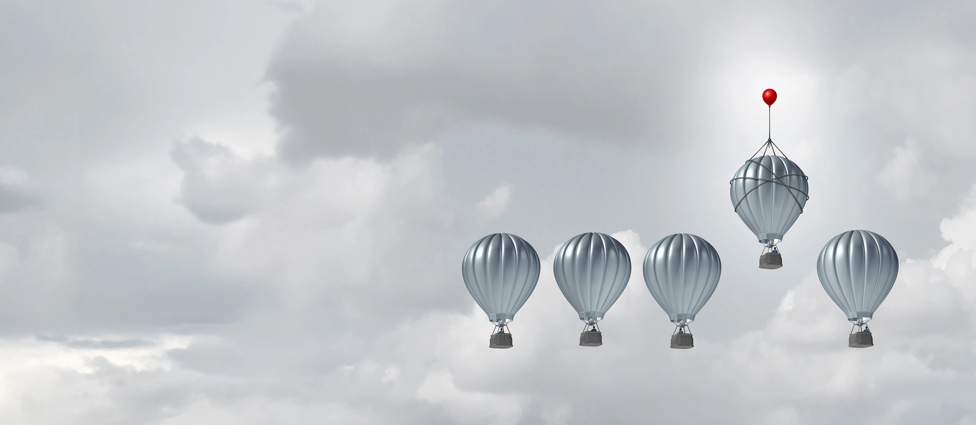 Symbolic image for backtesting in anti-money laundering: A group of hot air balloons, one being lifted by a red balloon – symbolizing comparison, calibration, and targeted optimisation of monitoring parameters.